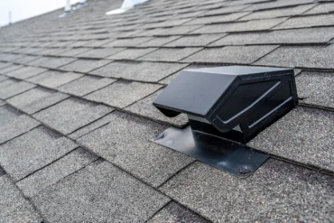 Static vent installed on a shingle roof for passive attic ventilation. attic insulation and roof ventilation