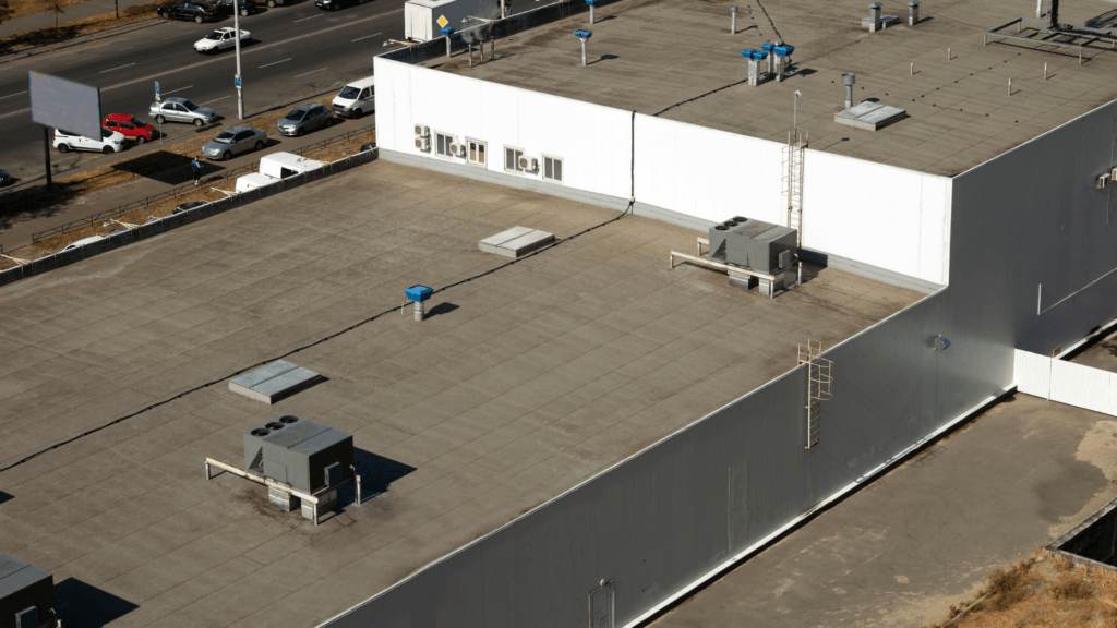 Commercial roofing Alabama crew working on a large warehouse rooftop