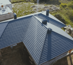 Metal roof installation on a Huntsville Alabama brick home with standing seam metal roofing