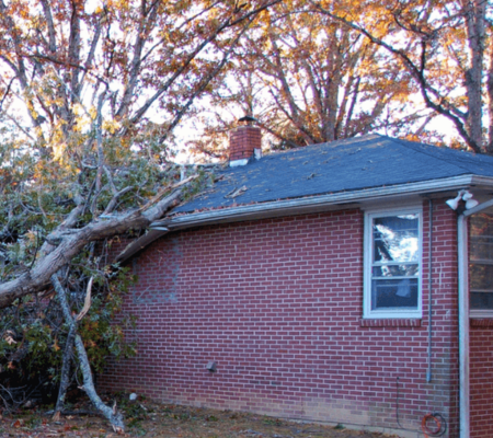 Tree fallen on house roof requiring emergency roof repair in Huntsville AL