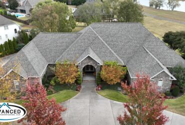 Roof replacement cost breakdown for a Huntsville AL residential home with new shingles being installed