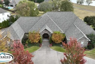 Roof replacement cost breakdown for a Huntsville AL residential home with new shingles being installed