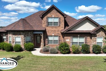 Repaired rooftop in Huntsville showcasing roof color energy efficiency Alabama benefits