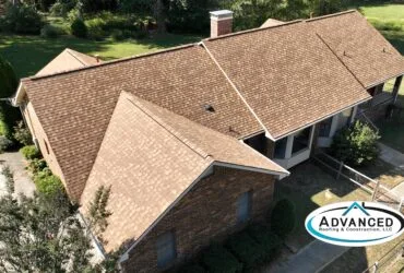 roofers near me Huntsville contractor working on a residential roof
