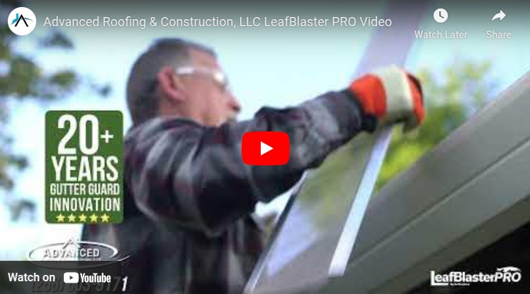 Installer fitting LeafBlaster PRO gutter guard on roof