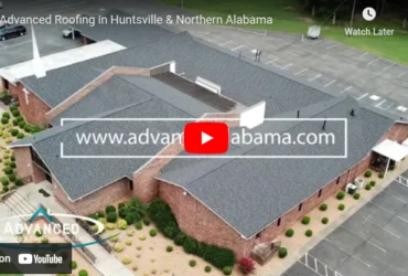 Aerial view of building with new roof by Advanced Roofing