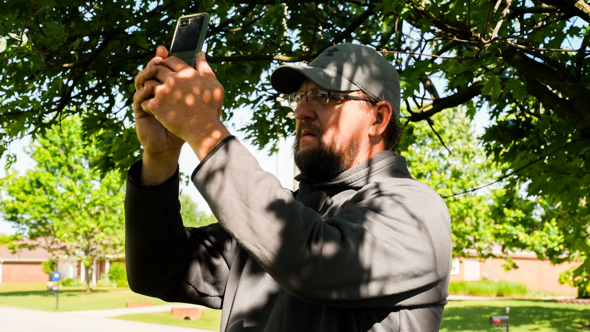 Advanced Roofing representative documenting roof damage for an insurance claim